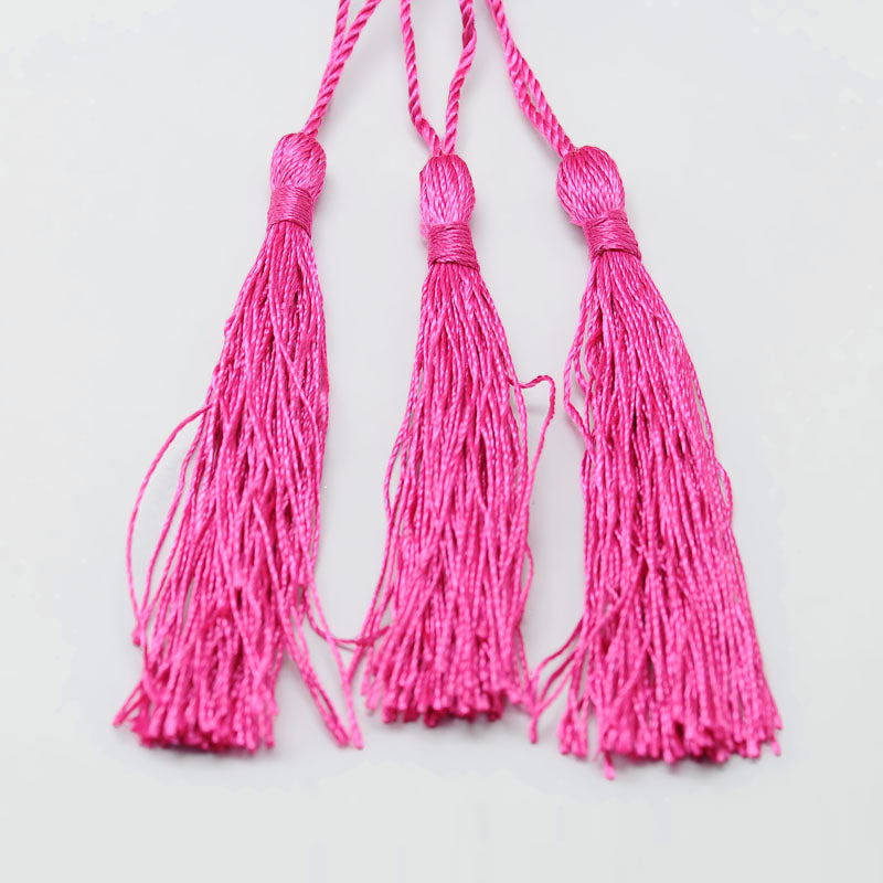 Mörk rosa tassel tofs - 1st